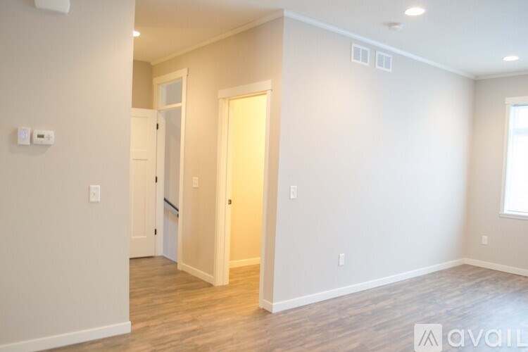 A room with a doorway leading to another room.