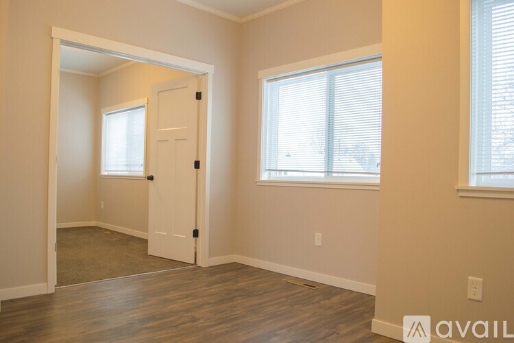 A room with a door and a window.