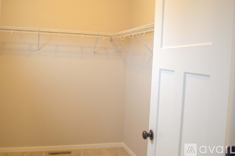 A white door is on the right side of the image.