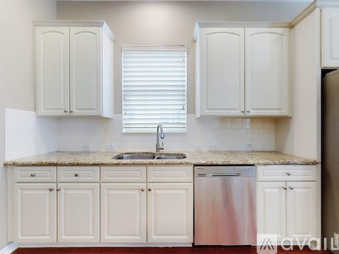 A spacious room with a ceiling fan and tiled flooring.