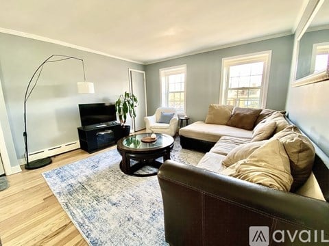 A dining room with a table and chairs.