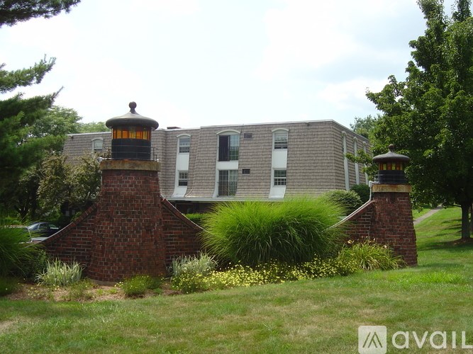 A house with a brick chimney and a large window.