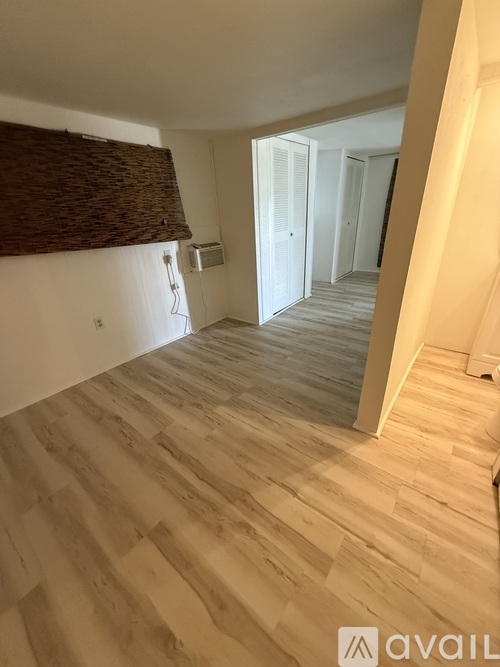 A kitchen with white cabinets and a white oven.