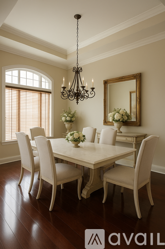 A dining room with a table set for four.