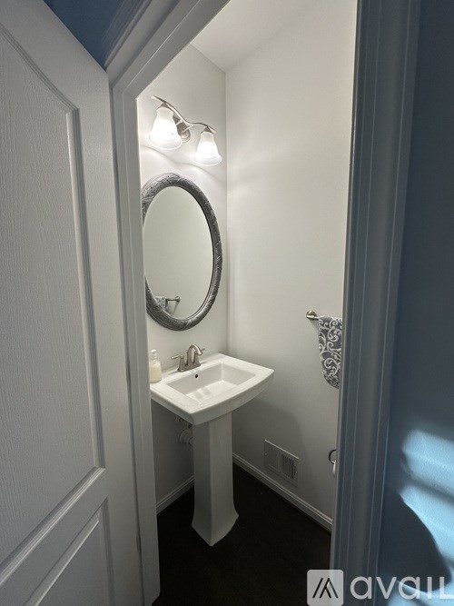 A kitchen with granite countertops and a ceiling fan.