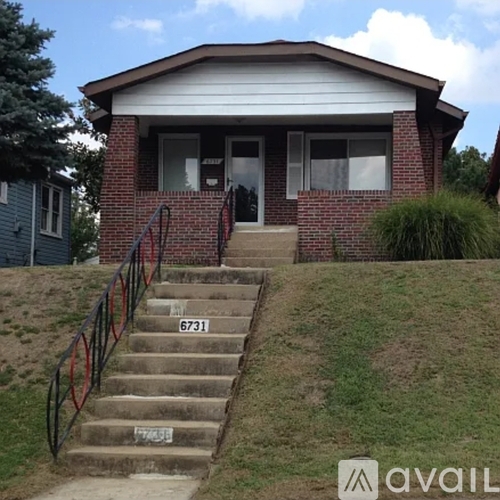 House number 6731 with stairs leading to the front door.
