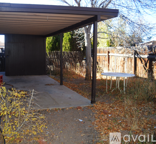 A patio area with a table and chairs is shown.