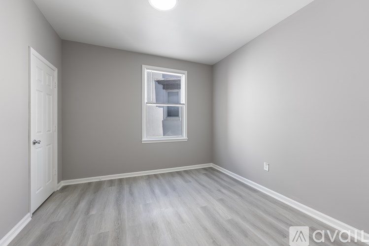 A room with a window and a door.