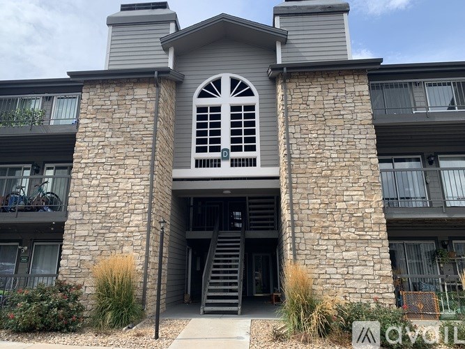 A balcony with a door and a railing.