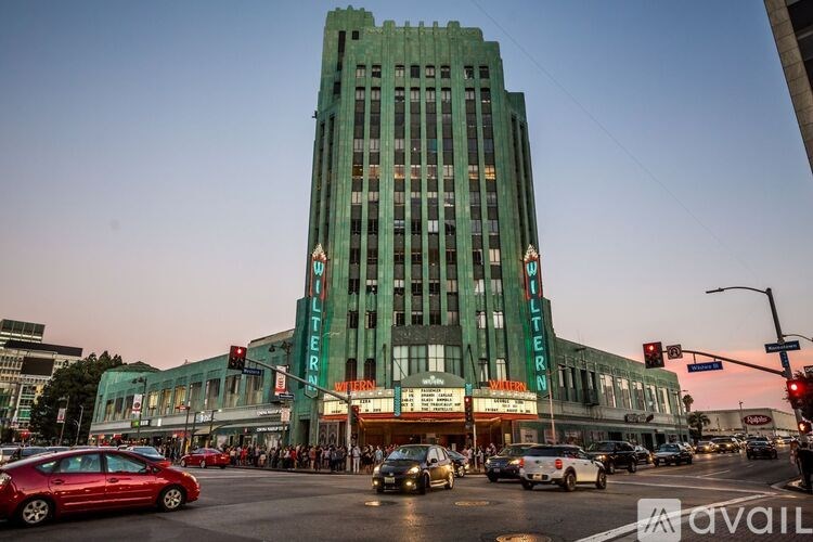 A tall green building with the word "Liberal" on it.