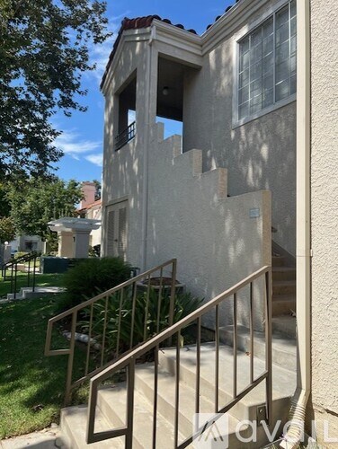 A house with a staircase leading to the second floor.