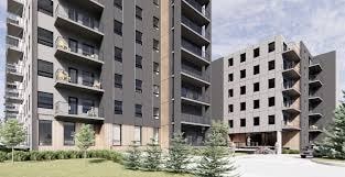 A large concrete building with balconies and windows.
