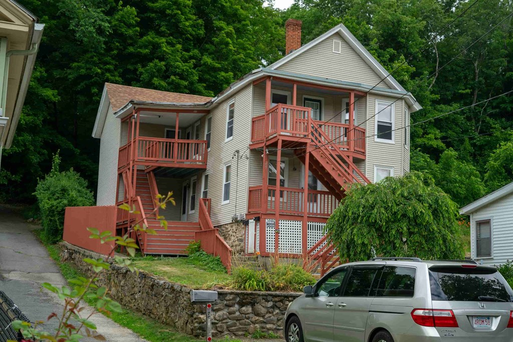 A house with a red deck and stairs.