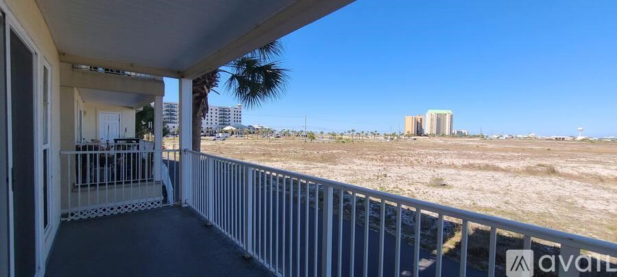 A balcony with a view of a distant building.