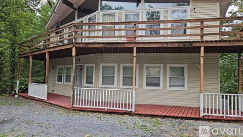 A house with a balcony and a red floor.