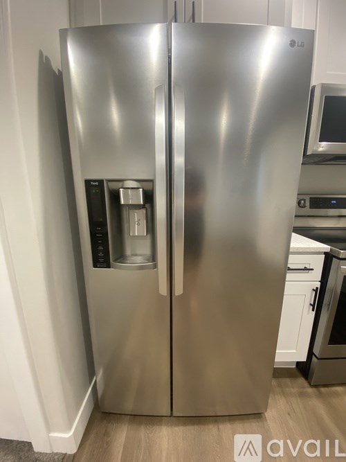 A stainless steel LG refrigerator with its freezer compartment visible.