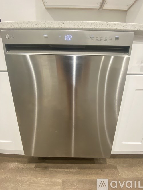 A stainless steel dishwasher with the brand name LG on the top.