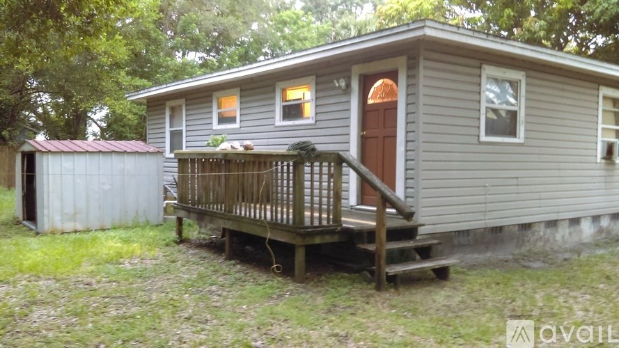 A house with a brown door and a porch.