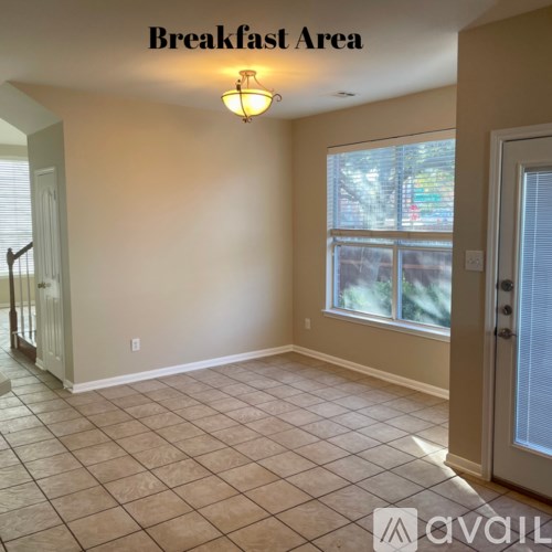 A room labeled as Breakfast Area with a tiled floor and a window.