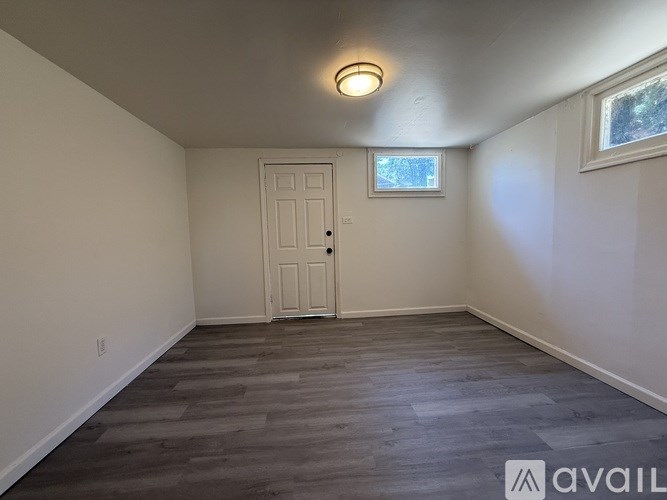 A room with a door and a window.