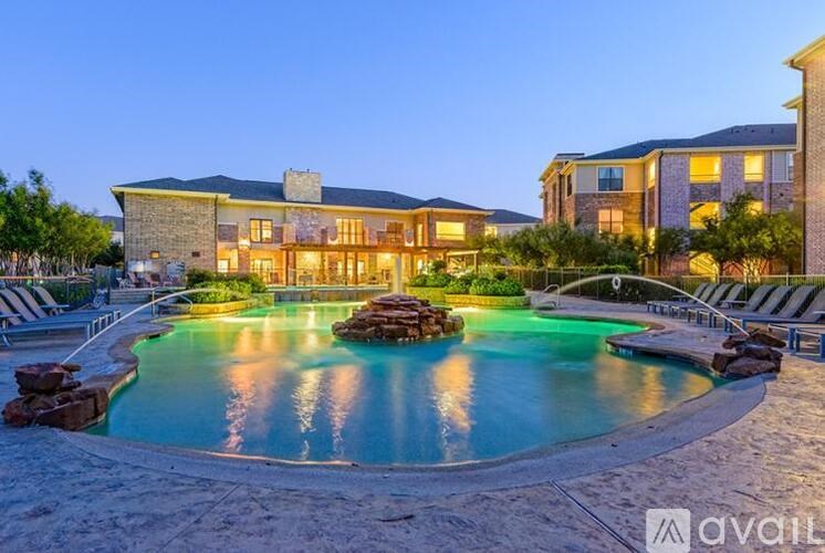 A large house with a pool in front of it.