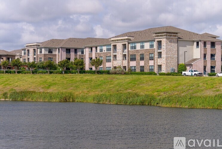 A large building with a grassy area in front of it.