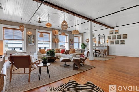 A living room with a zebra rug on the floor.