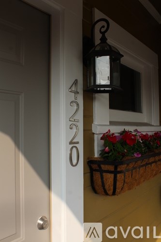 A house number 4220 is displayed on a white door.