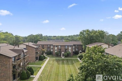 A view of a residential area with houses and greenery.
