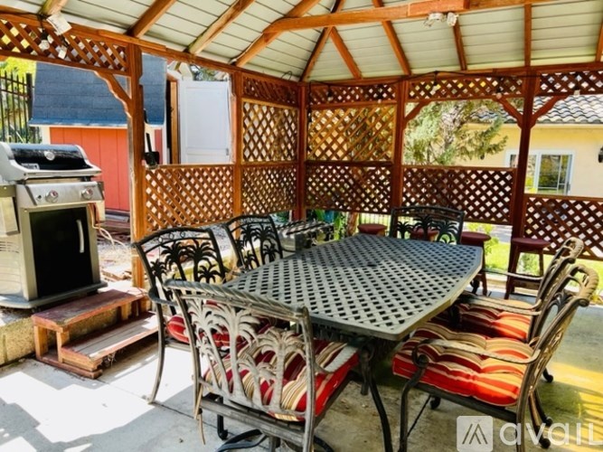 A table and chairs are set up on a patio.