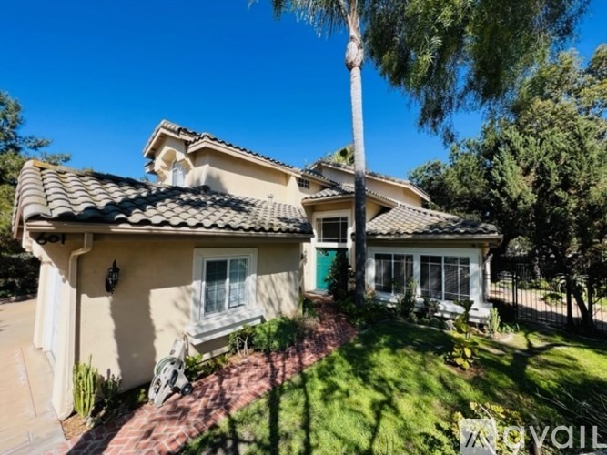 A house with a green door and a white window.