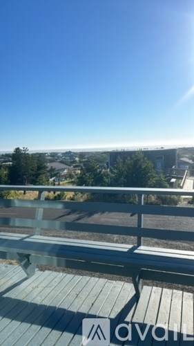A balcony with a view of a town.