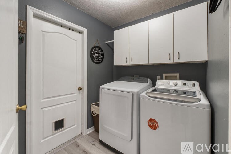 A laundry room with a washer and dryer.