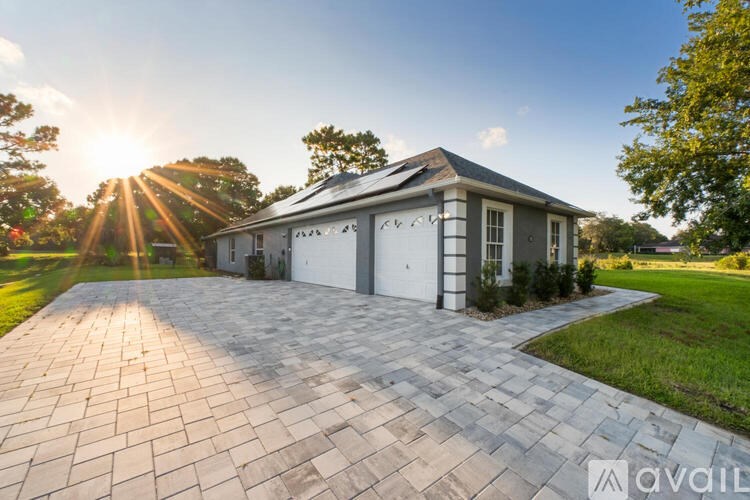 A house with a driveway in front of it.