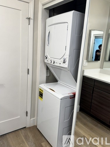 A white dishwasher is open in a kitchen.