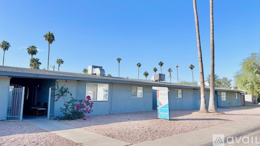 A row of houses with a sign in front of them that says "available".
