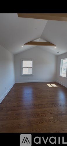 A white door is open to a laundry room.