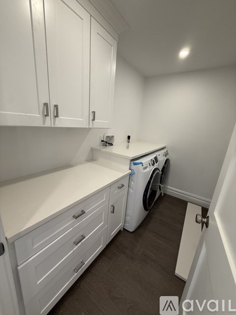 A laundry room with a washer and dryer.