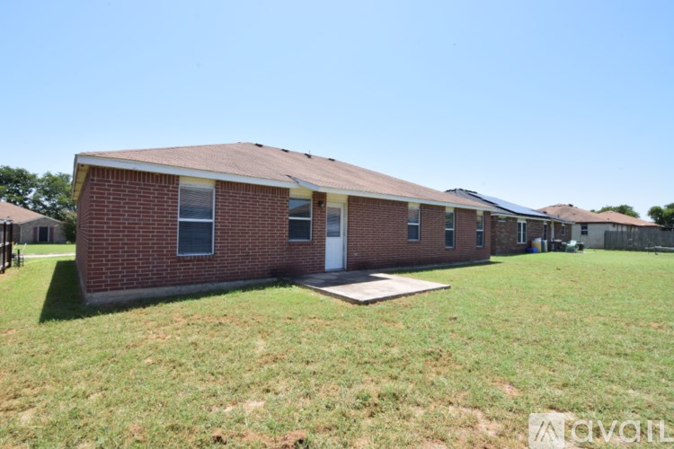 A brick house with a white door and a small porch.