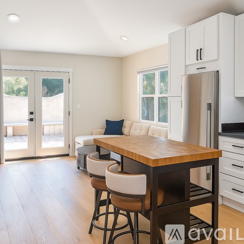 A bathroom with a sink, toilet, and a shower with a glass door.