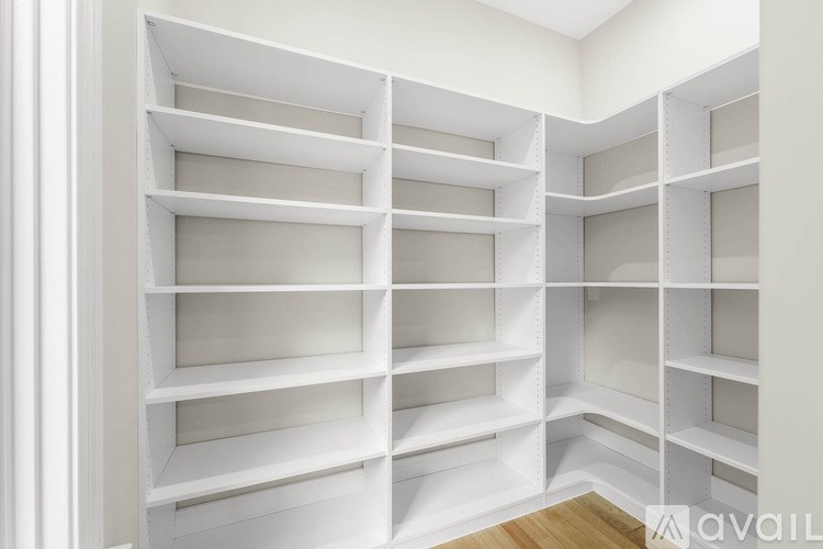 A white shelving unit with multiple shelves.