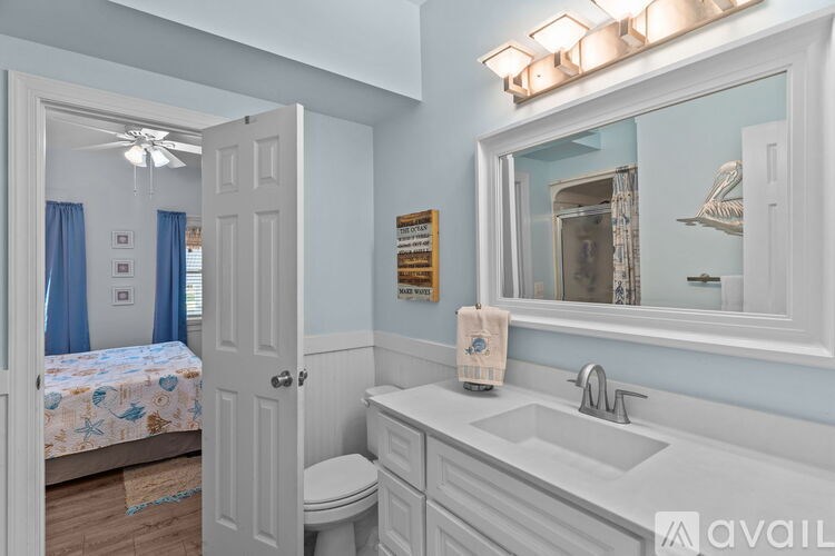 A wooden deck with a staircase leading to a roof.