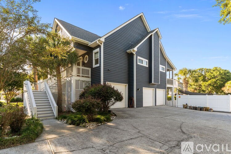 A house with a grey exterior is available for rent.