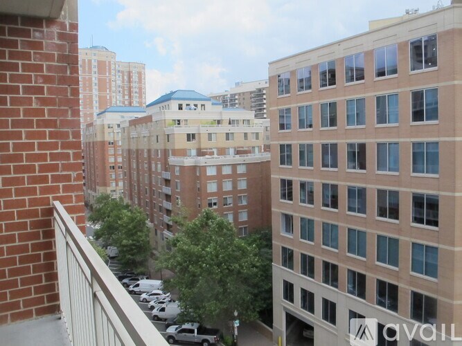 A view of a cityscape from a balcony.