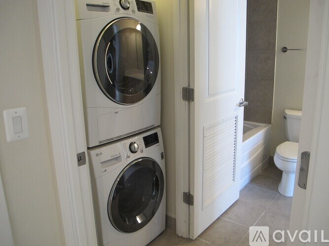 A white washer and dryer in a small laundry room.