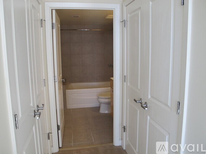 A bathroom with a toilet and a bathtub is shown.