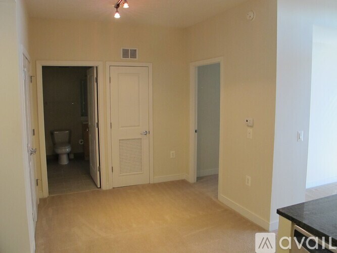 A room with a toilet and a cabinet is available.