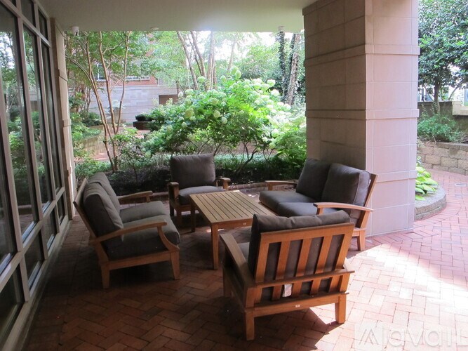 A patio with a table and chairs.