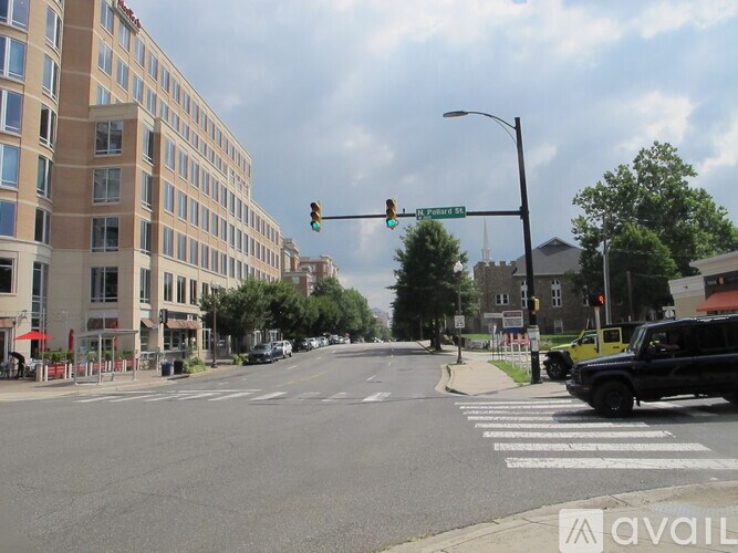 A street view with a traffic light at the intersection.