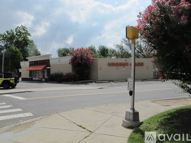A street view with a building that has a sign that says "Winston's Bar".